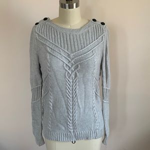 Light grey sweater with button detail on shoulder